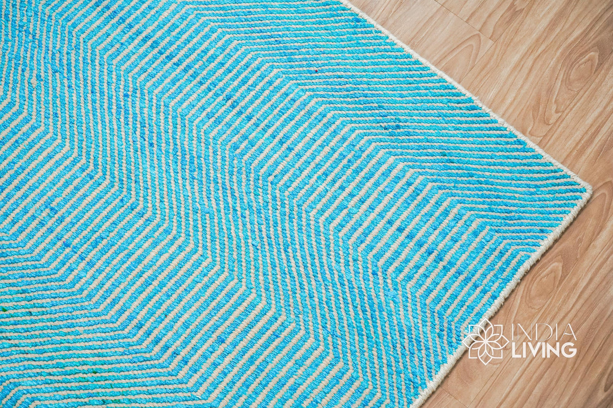 Top-down view of aqua blue wavy striped rug