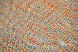 Multi blend diamond wool rug texture close-up showing handwoven weave