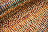 Multi blend orange wool rug under a coffee table