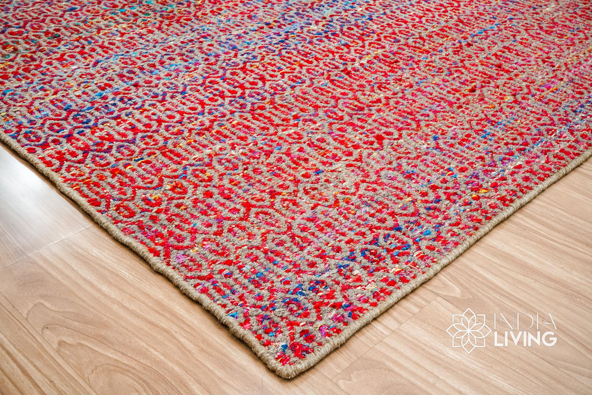 Multi blend red flatweave rug in a bedroom setting