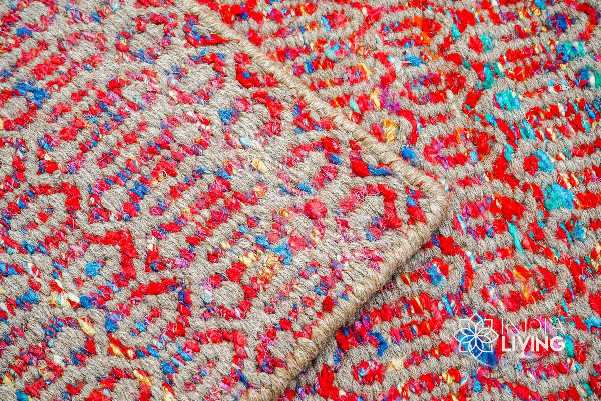 Top-down view of multi blend red geometric rug