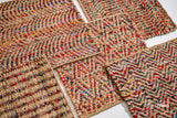 Top-down view of natural multicolour chevron striped jute rug