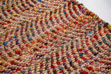 Natural jute ripple rug in a bright entryway setting