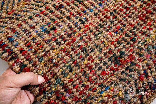 Natural jute chevron striped rug styled in a living room