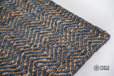 Close-up of ribbed herringbone weave texture on jute wool rug