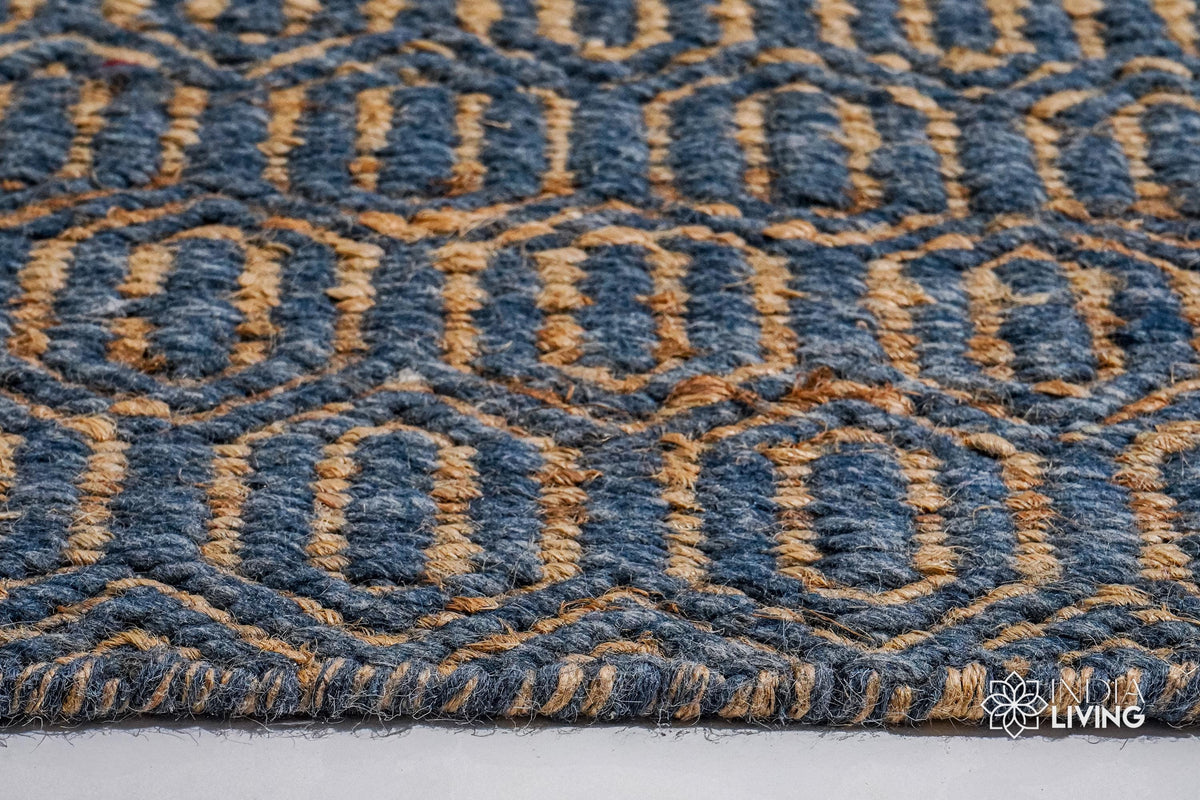 Bluish grey diamond flatweave rug styled in a living room