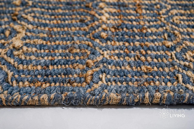 Bluish grey geometric flatweave rug styled in a living room