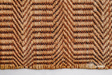 Orange chevron weave rug in a hallway entryway