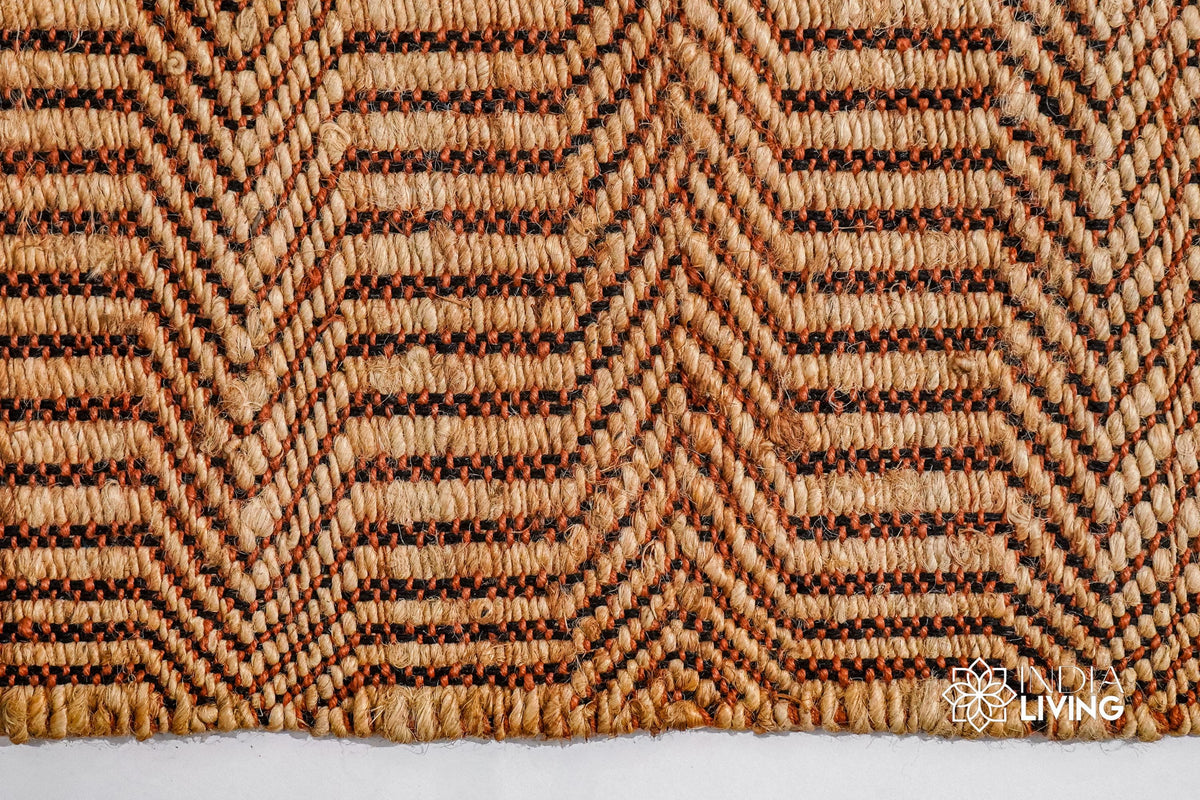 Orange chevron weave rug in a hallway entryway