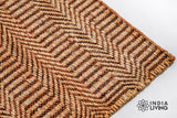 Handwoven orange jute rug in a modern boho living space