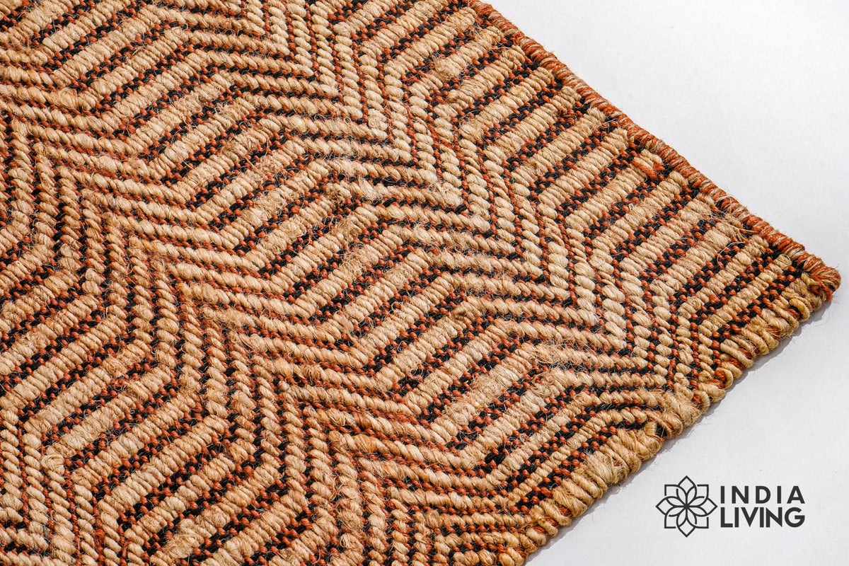 Handwoven orange jute rug in a modern boho living space