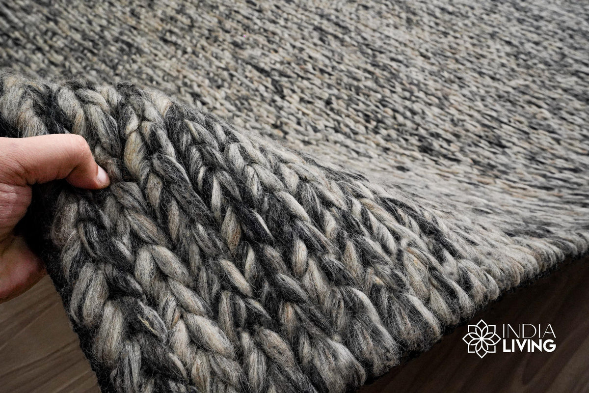Handwoven grey wool rug in a modern living room