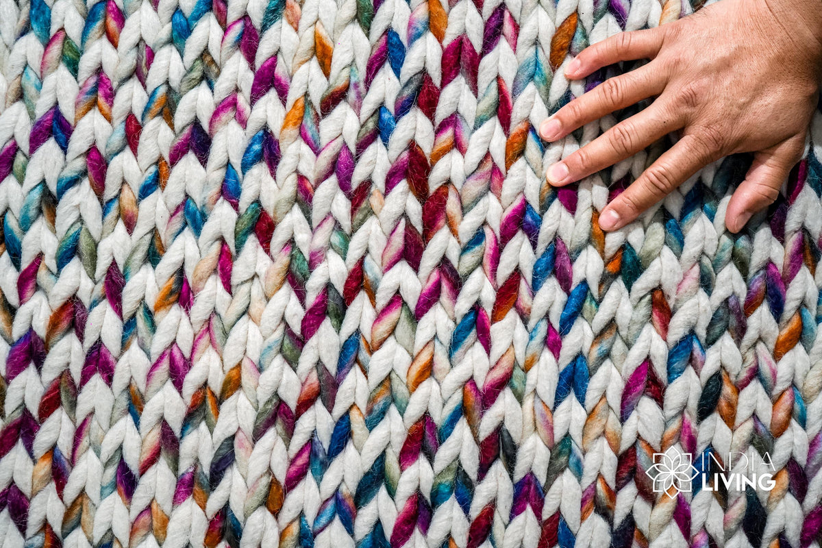 Full view of colourful chunky rug on floor
