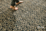 Jute diamond twill rug styled in a living room