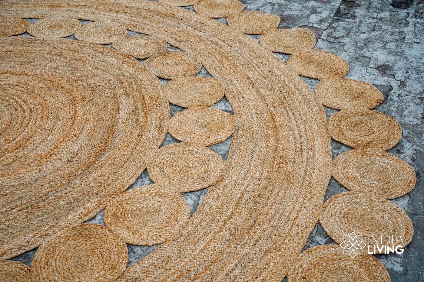 Round hand braided natural jute rug with medallion design, flat view
