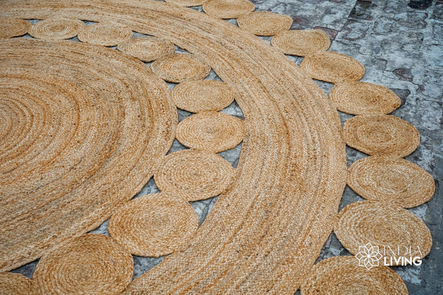 Round hand braided natural jute rug with medallion design, flat view