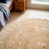 Round jute rug styled in a living room