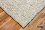 Ivory cream wool rug pile texture close-up
