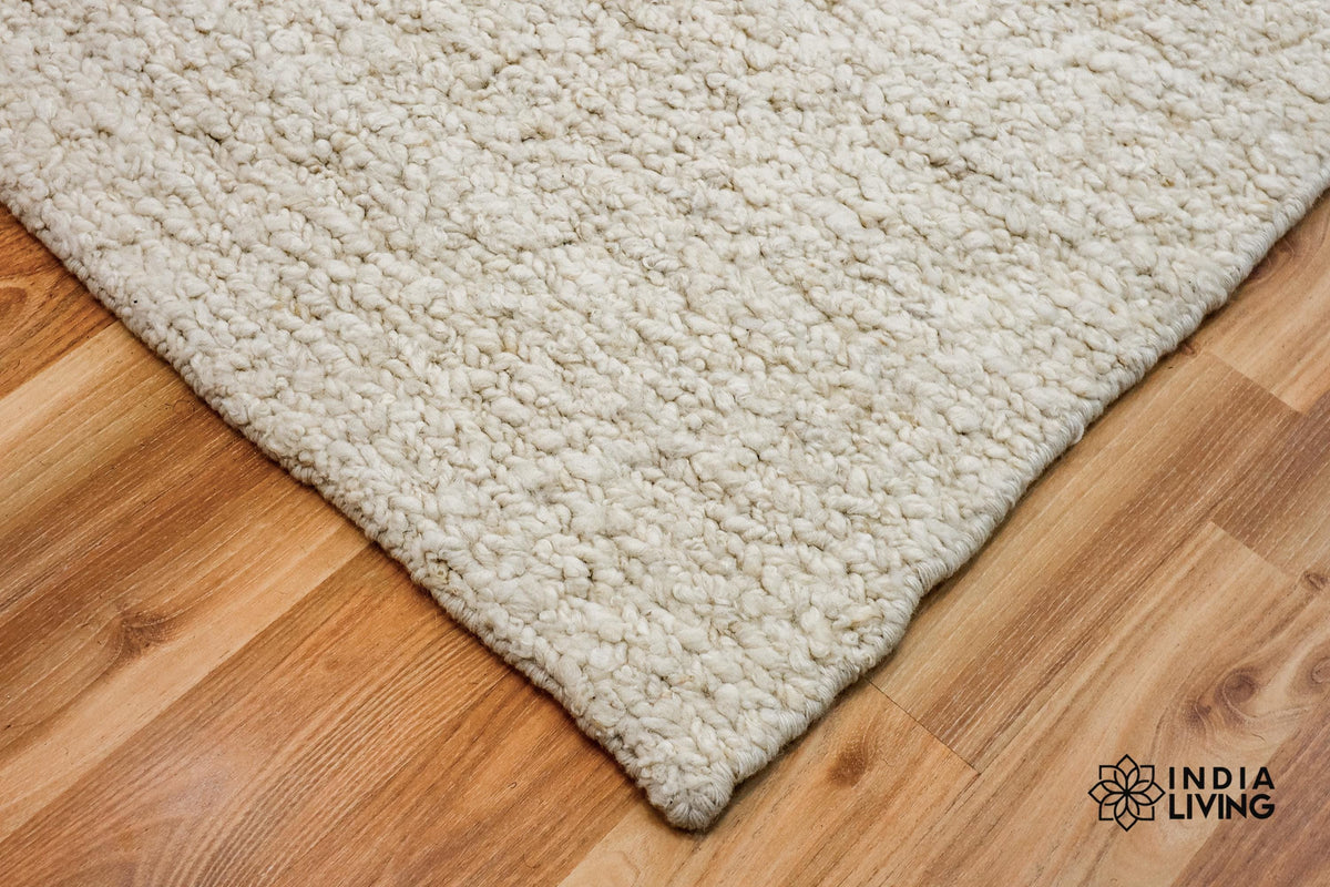 Ivory cream wool rug pile texture close-up