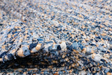 Handwoven denim rag rug in a modern boho living space