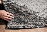 Grey wool rug pile close-up texture shot