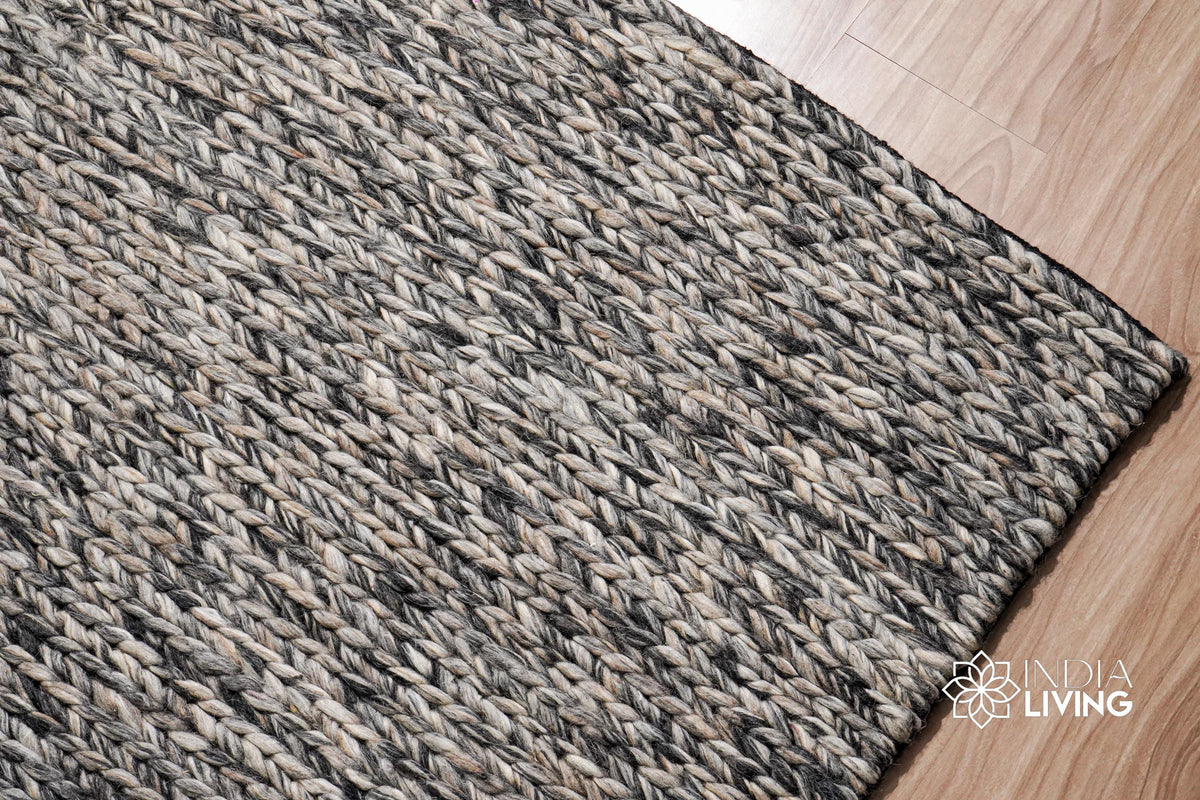 Grey chunky wool rug styled in a Scandinavian living room