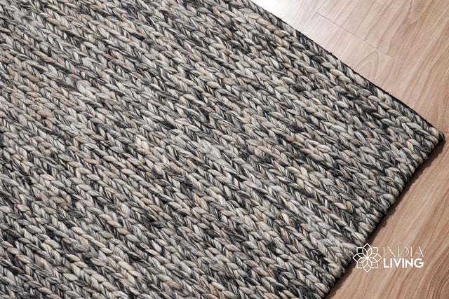 Grey chunky wool rug styled in a Scandinavian living room