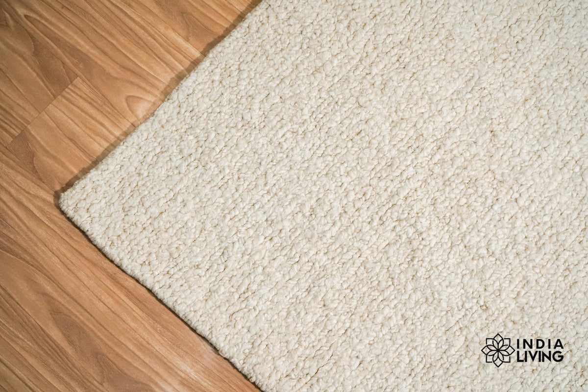 Ivory wool rug corner detail showing edge
