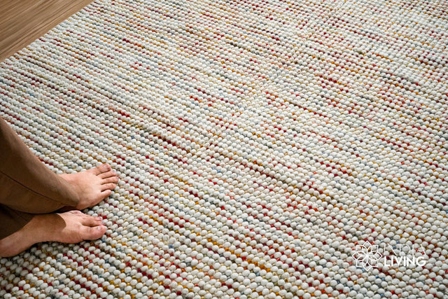 Chunky white wool rug styled in a living room