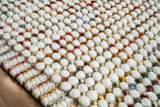 Chunky wool rug shown styled with furniture