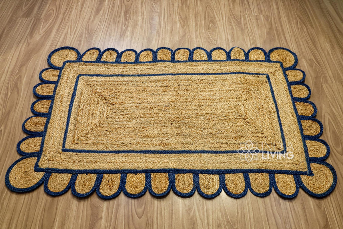 Hand braided navy blue rug shown in an entryway setting