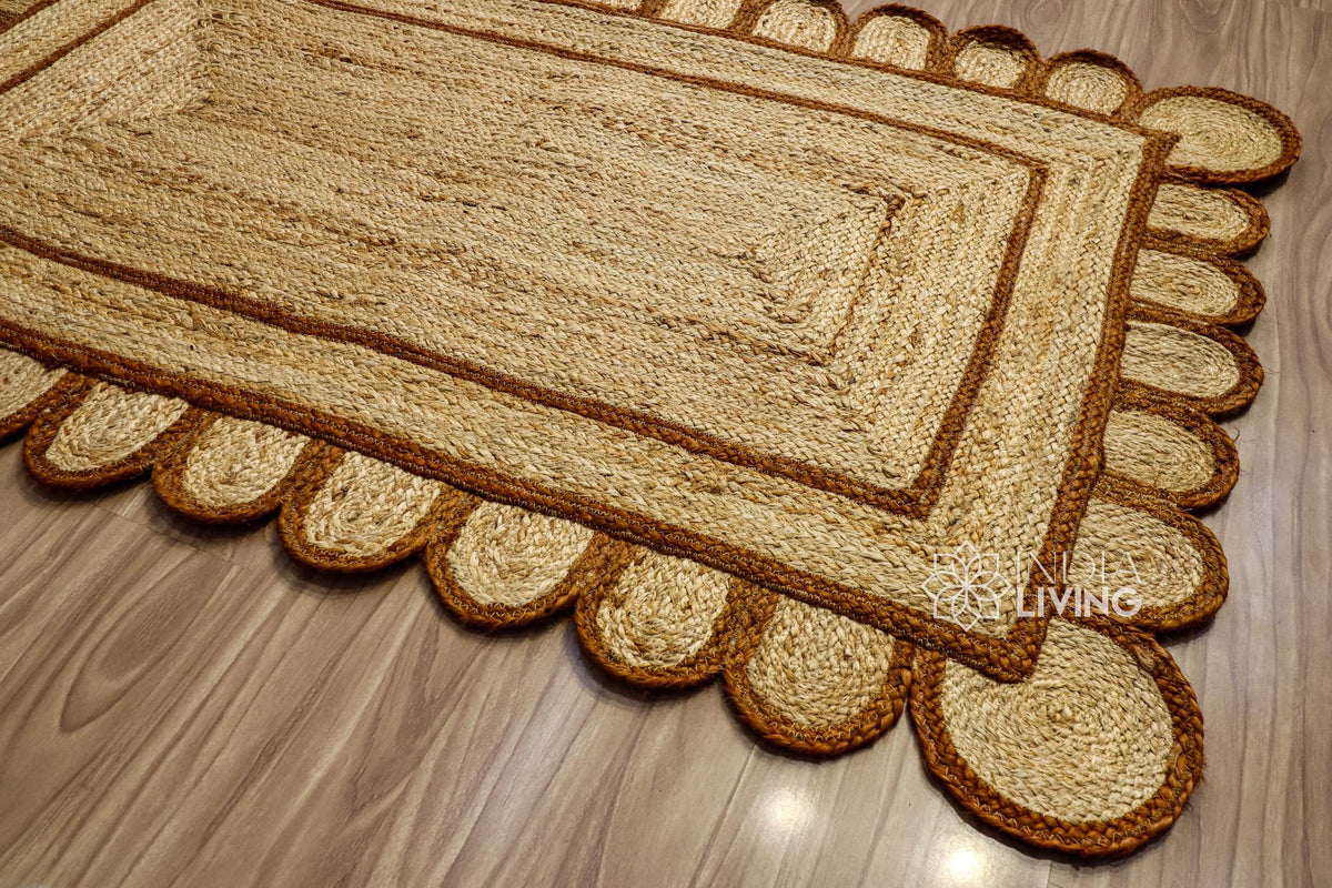 Close-up of scalloped edge on brown jute rug