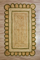 Hand braided olive jute rug in a modern boho living room