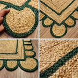 Close-up of scalloped edge on dark green jute rug