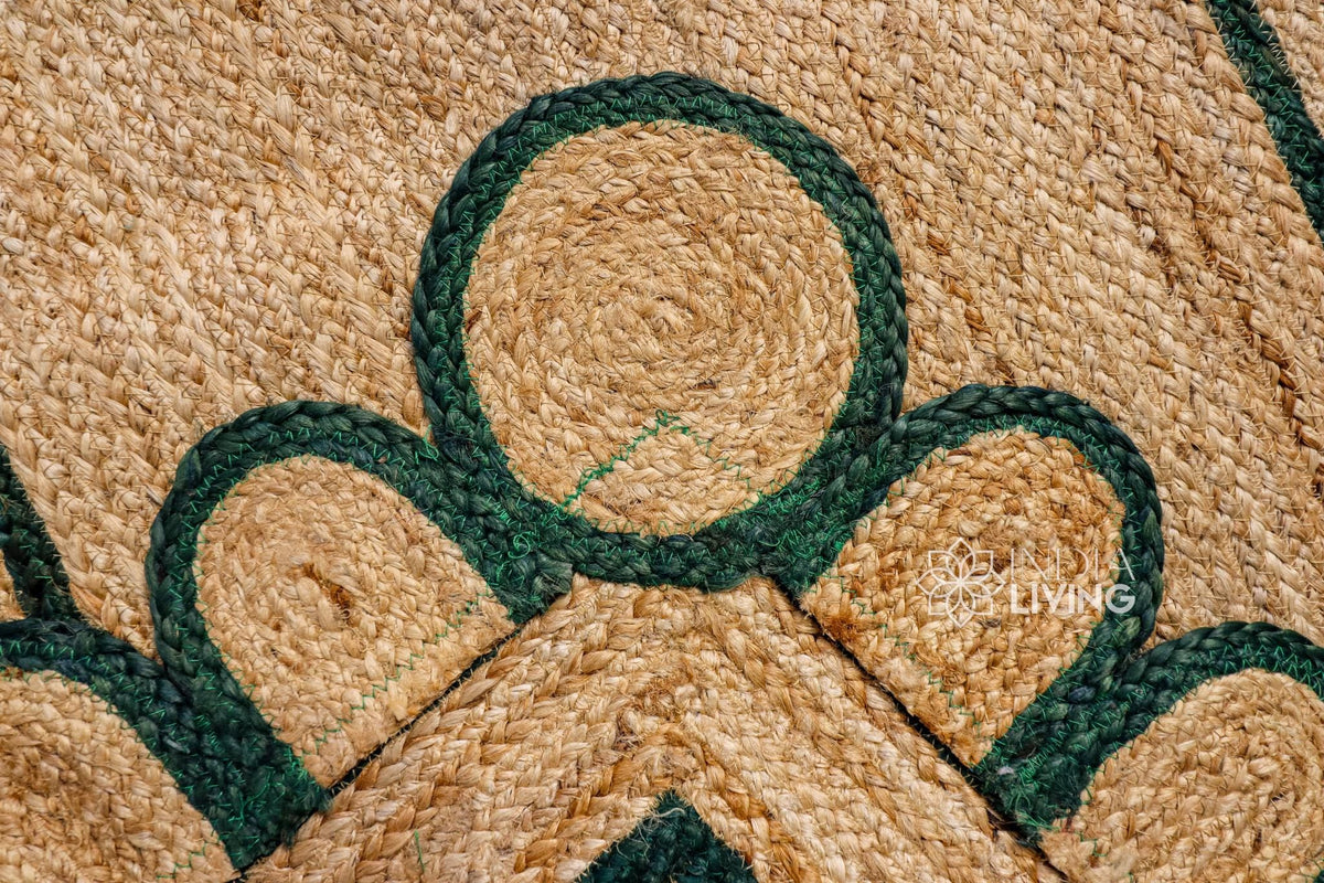 Hand braided dark green rug shown in an entryway setting