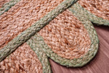 Pistachio green jute runner edge close-up highlighting scallop stitching