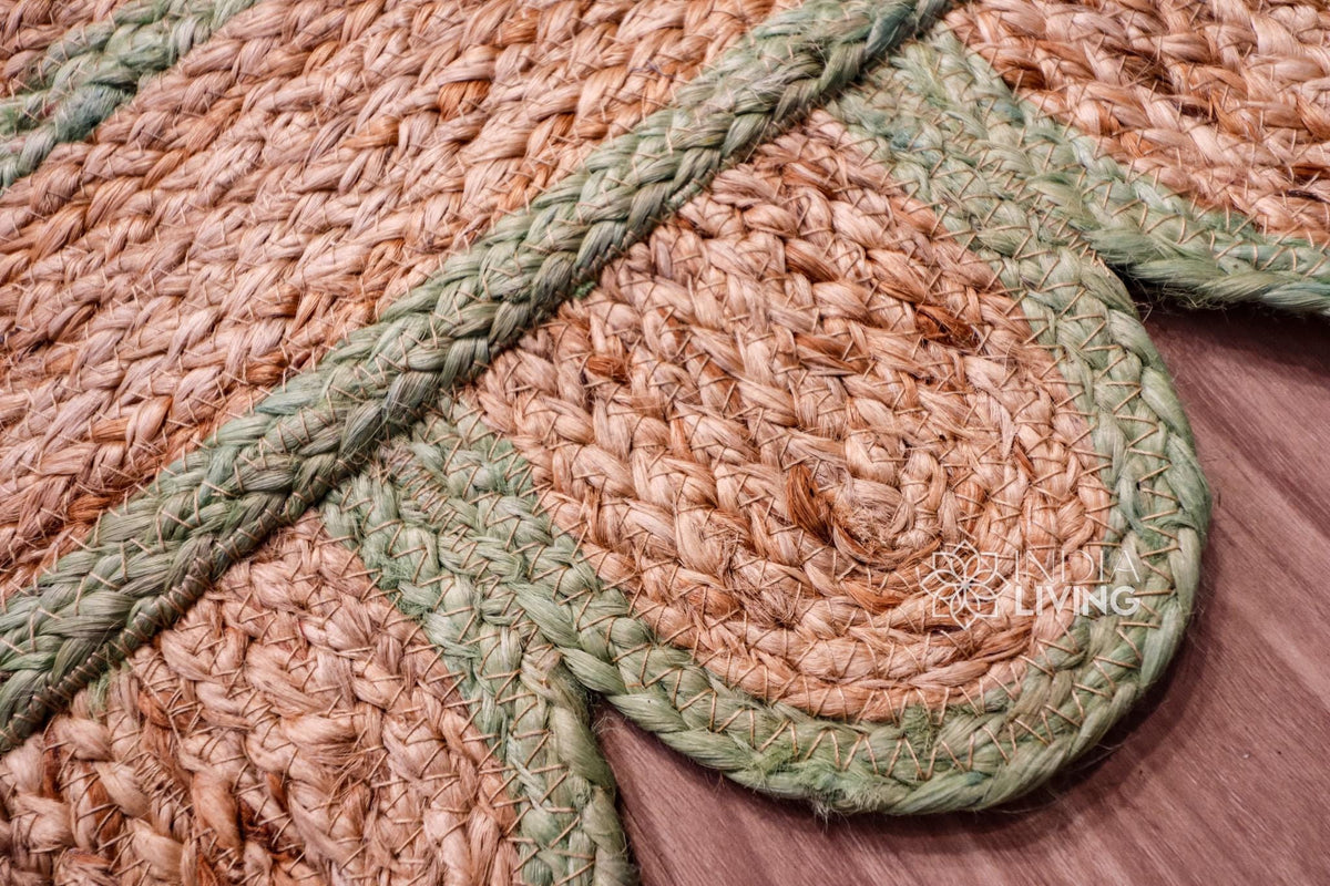 Pistachio green jute runner edge close-up highlighting scallop stitching