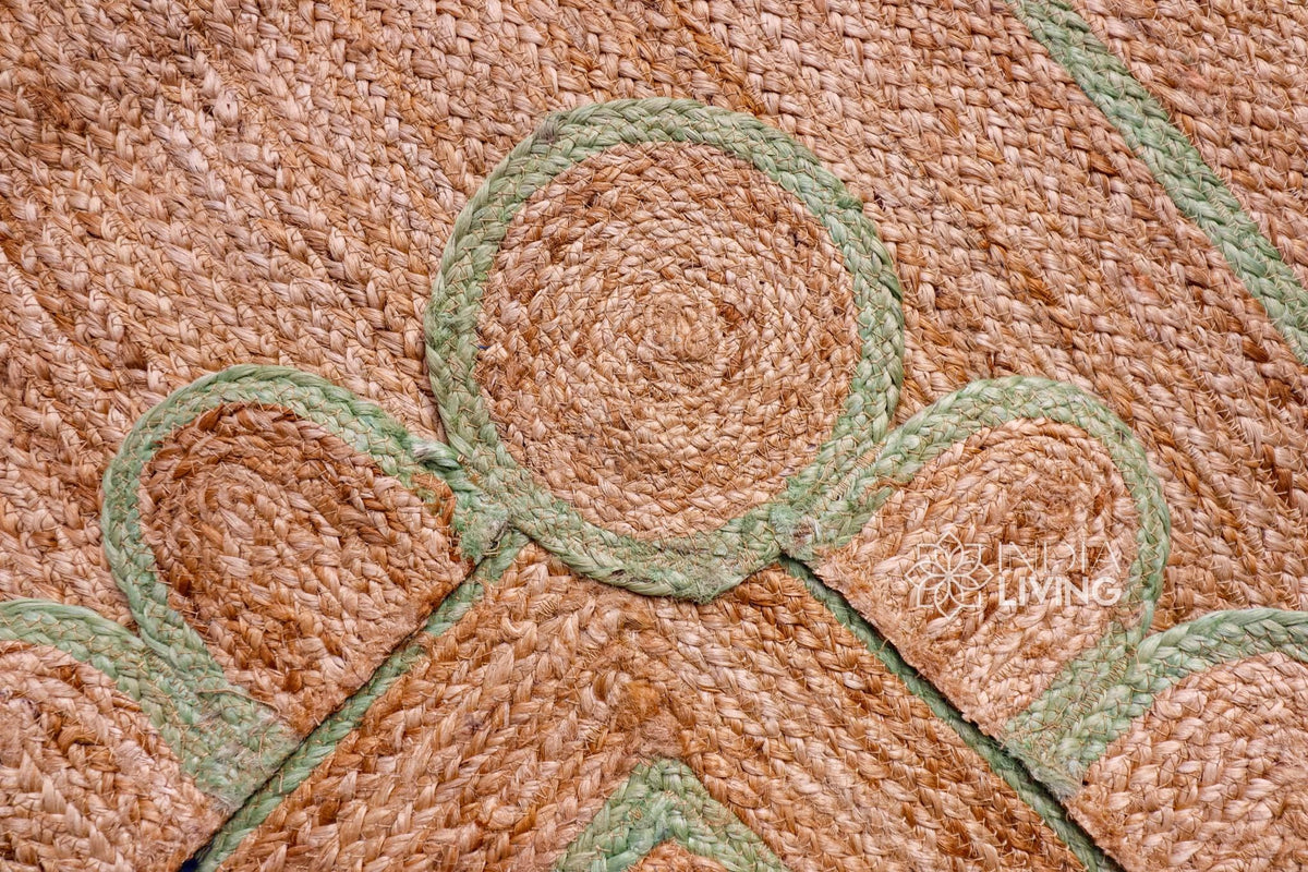 Close-up of scalloped edge detail on pistachio green jute runner