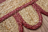 Burgundy jute runner edge close-up highlighting scallop stitching