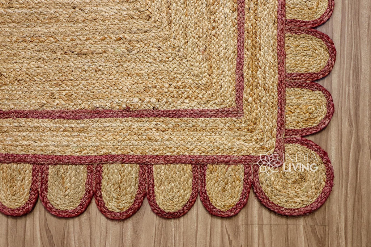 Corner view of burgundy jute runner showing braided weave