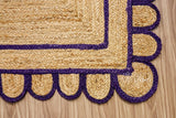 Overhead view of purple jute runner on wood flooring