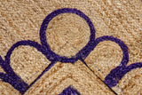 Close-up of scalloped edge detail on purple jute runner