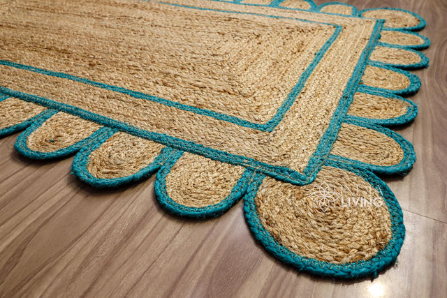 Teal blue scalloped jute runner laid flat, full view