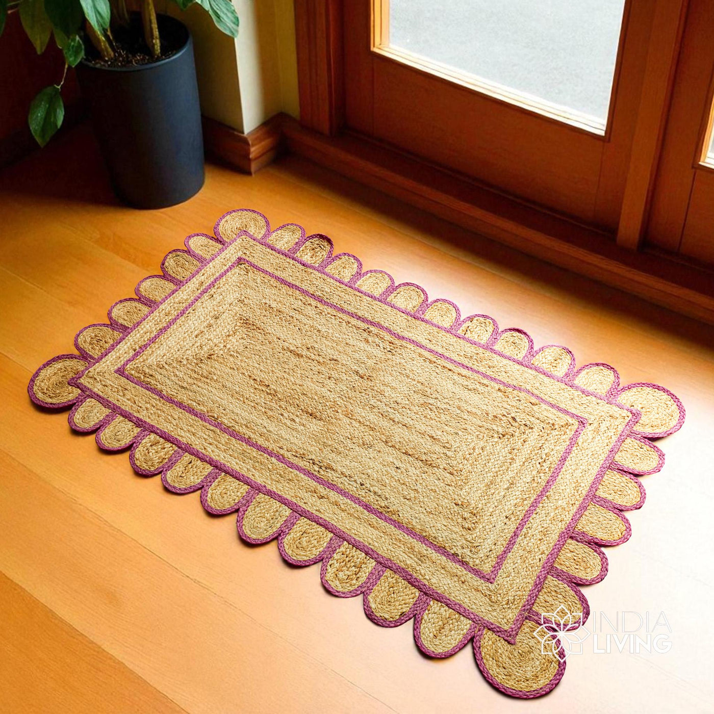 Pink scalloped jute runner laid flat, full view