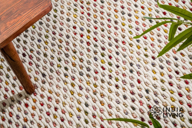 Ivory wool rug styled in a living room