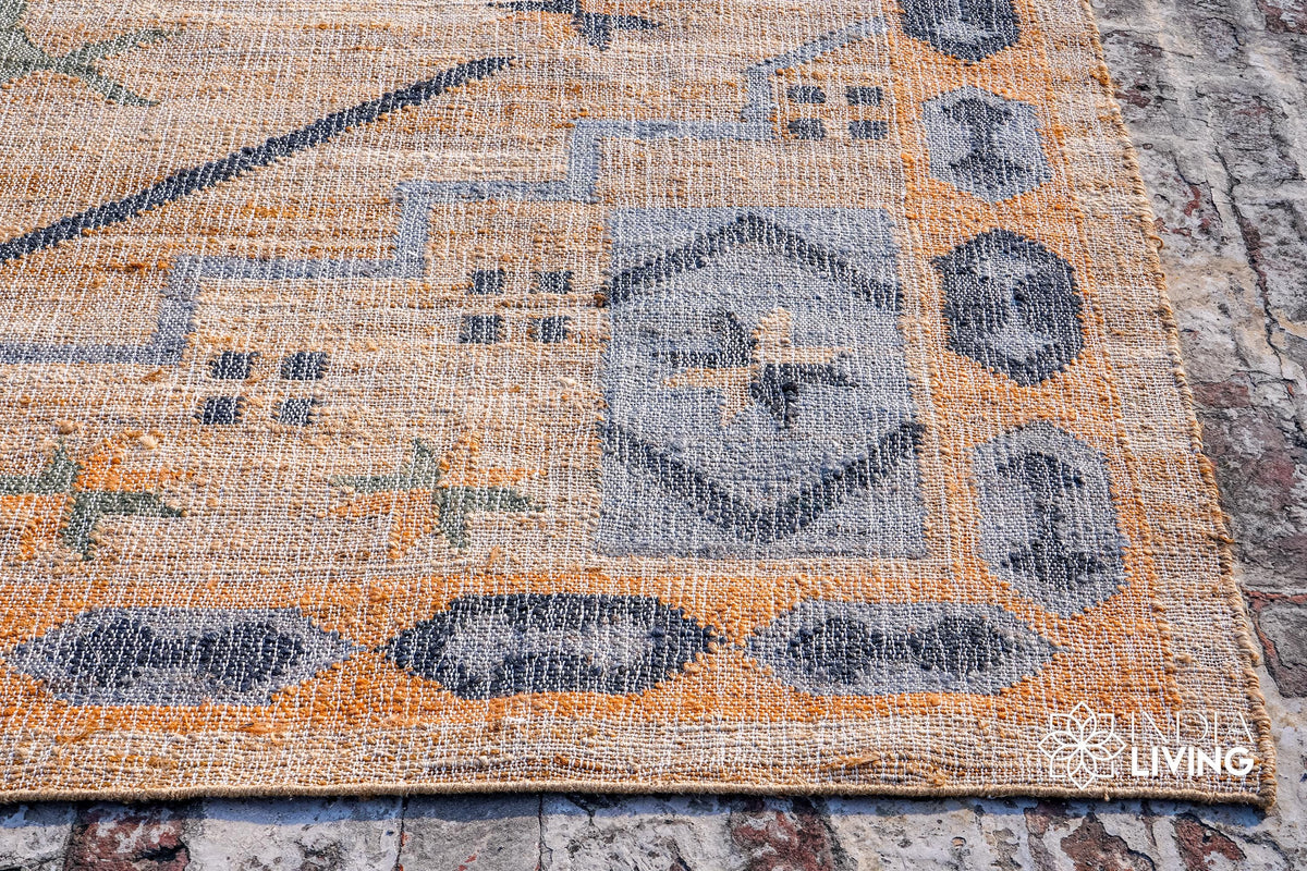 Light blue rust jute rug corner detail showing edge binding