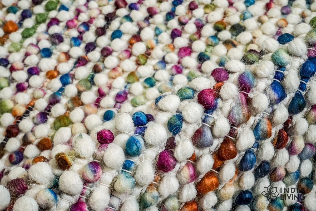 Detail of the rainbow wool loops and woven edge finish