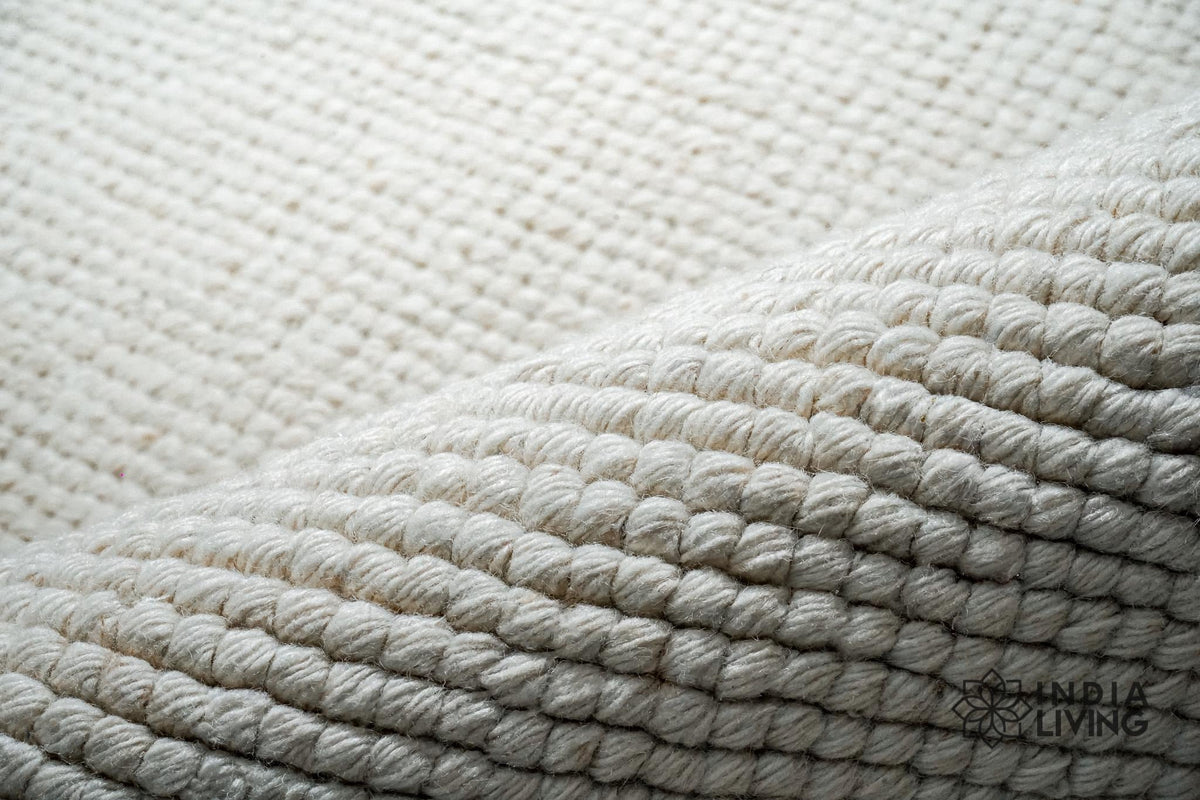 Close-up of ivory wool rug texture