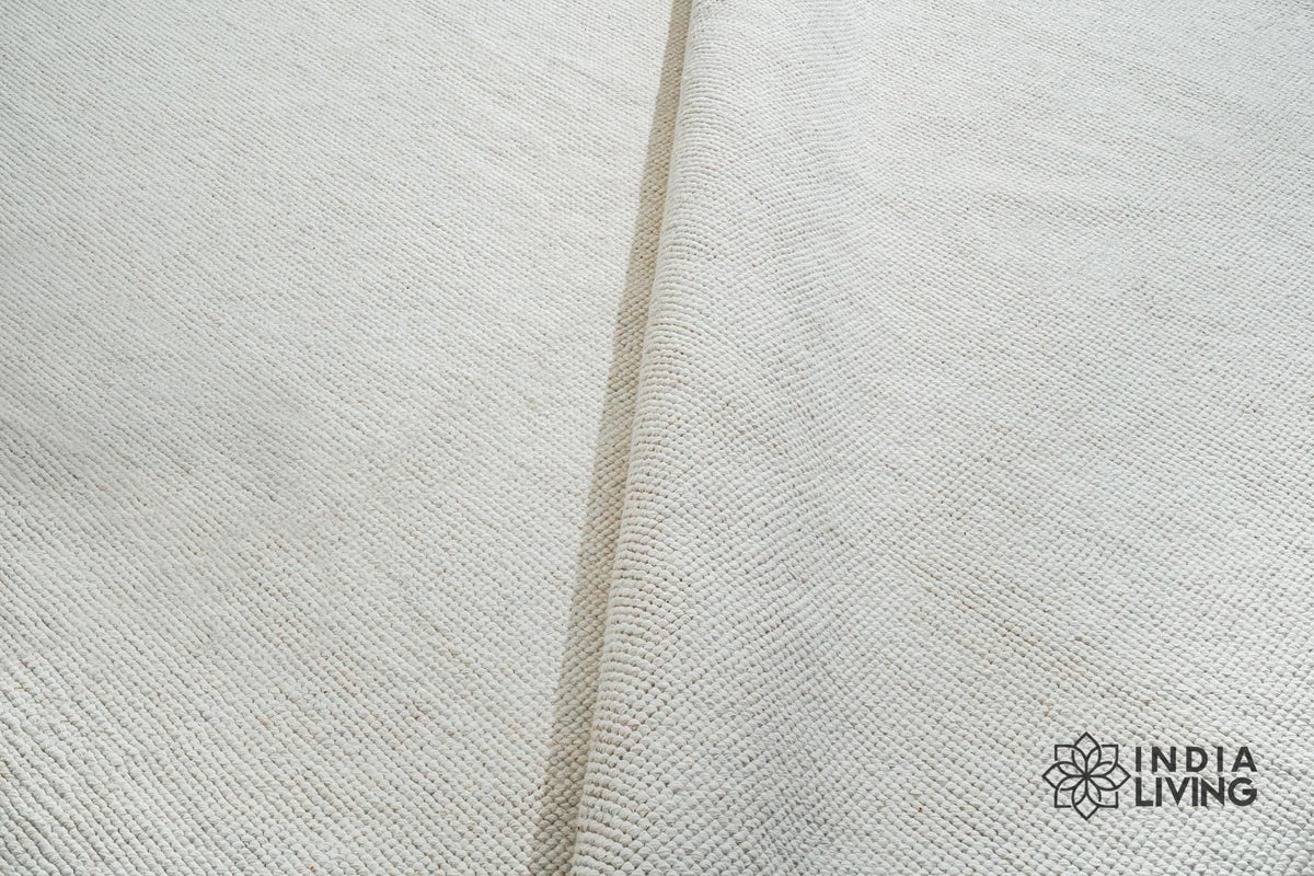 Ivory wool rug texture close-up
