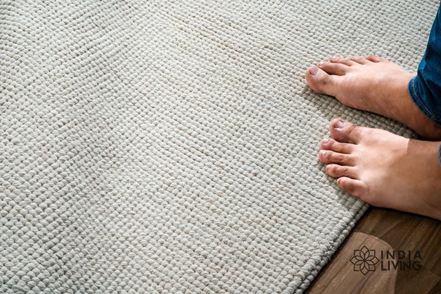 Ivory solid wool rug, full flat view